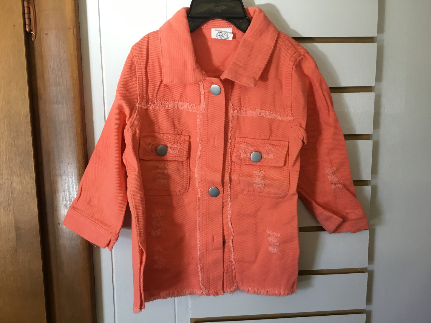Orange distressed denim jacket